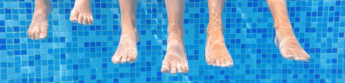 photo of feet in a swimming pool