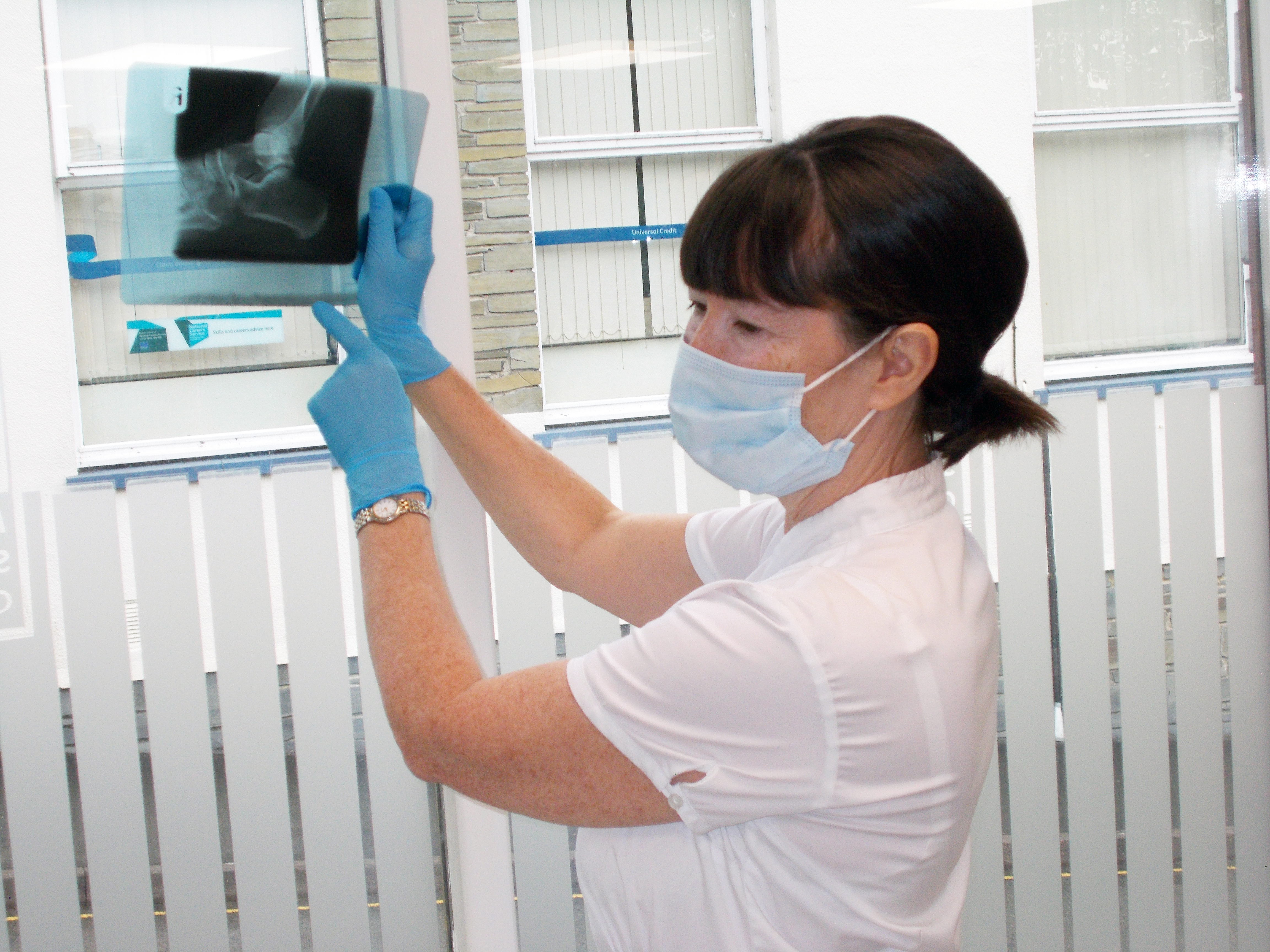 photo of chiropodists checking a x-ray